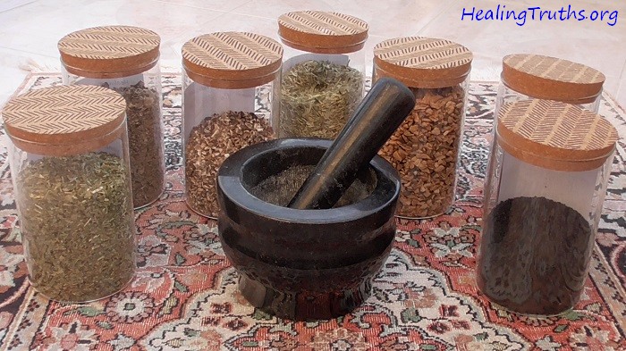 Image of a pestle and mortar surrounded by jars of herbal medicine